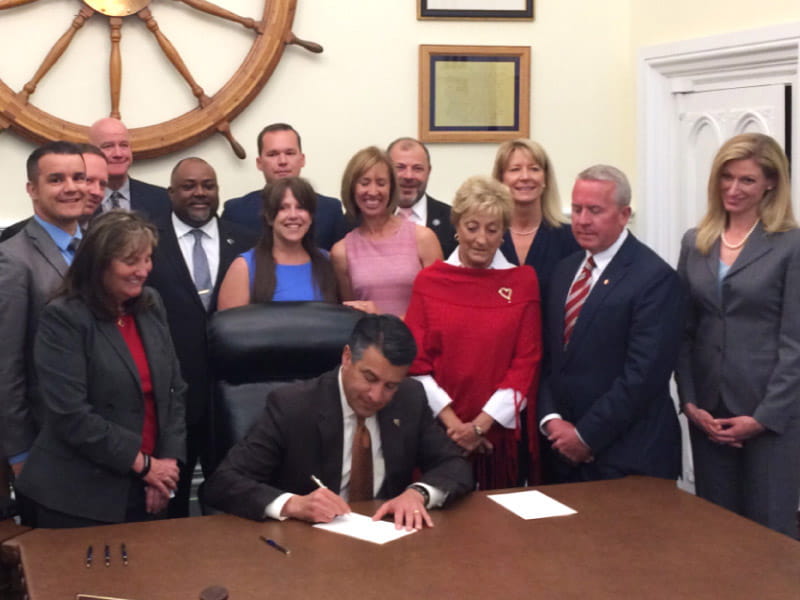 Representatives from the 91Ƶ’s You’re the Cure grassroots network join Nevada state legislators and then-Gov. Brian Sandoval on May 15, 2017, in Carson City as he signs Assembly Bill 85 into law. 
